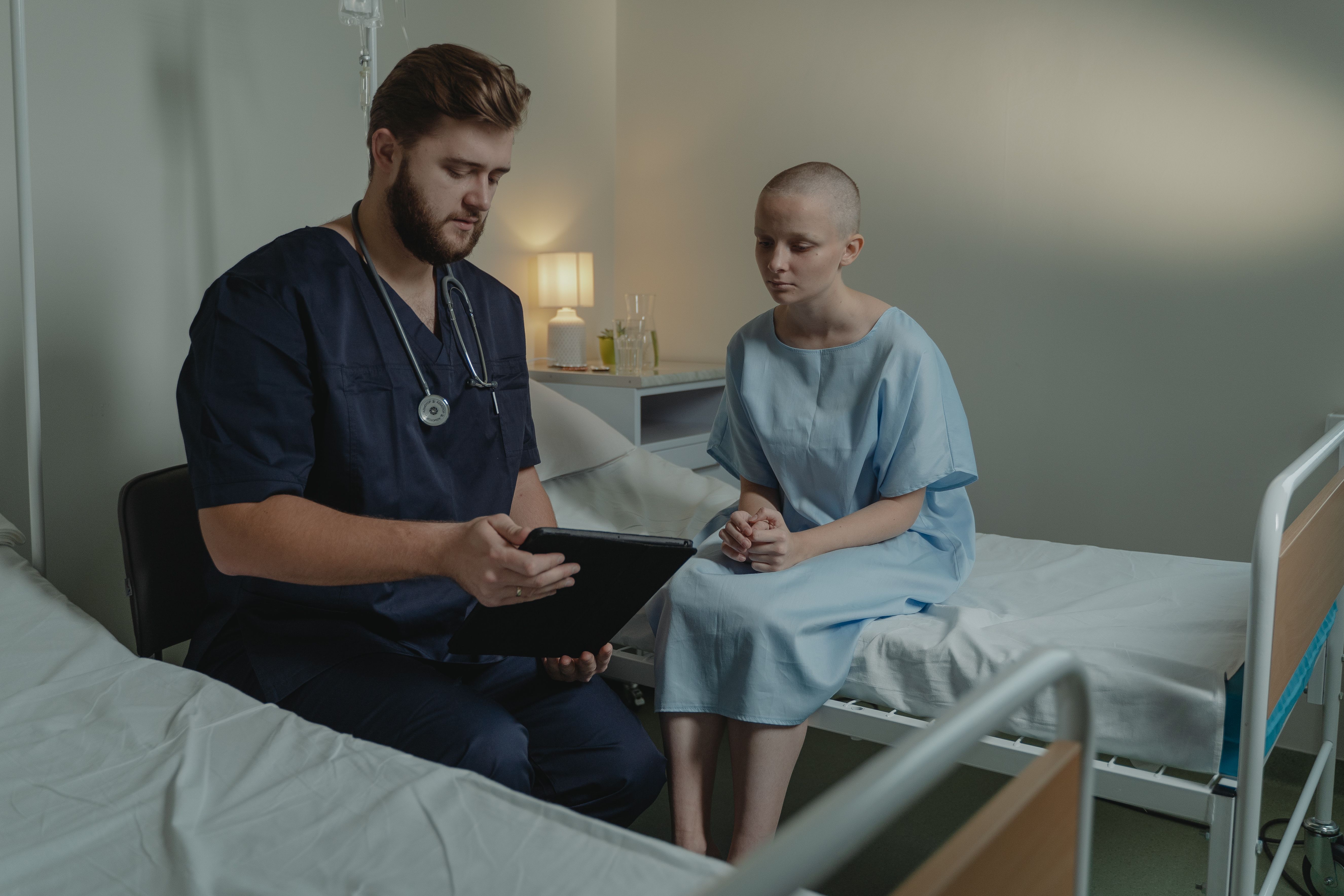 Oncology nurse caring for a patient during treatment